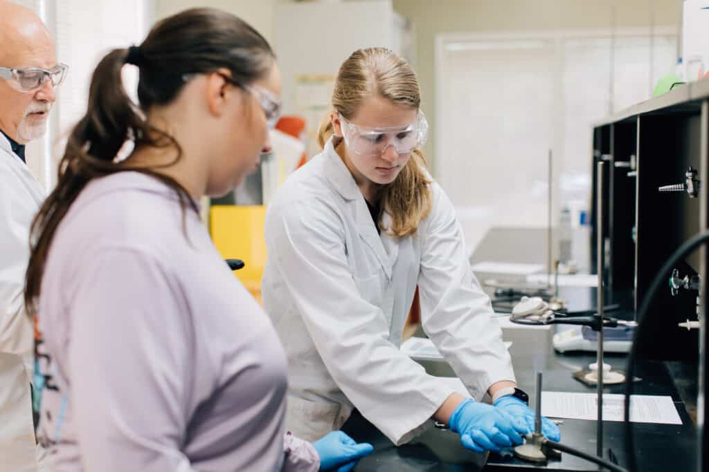 Students working in their lab coat.