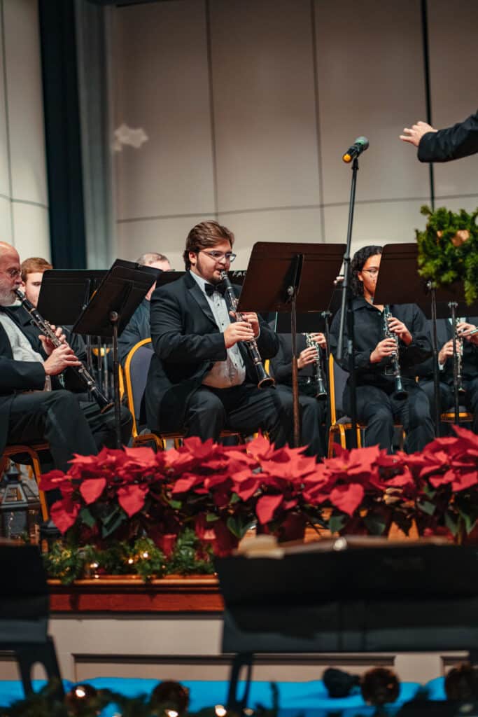 man playing clarinet in band