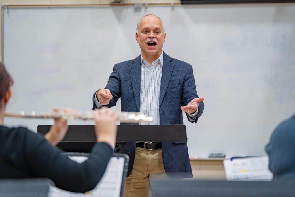 Professor conducting a band.