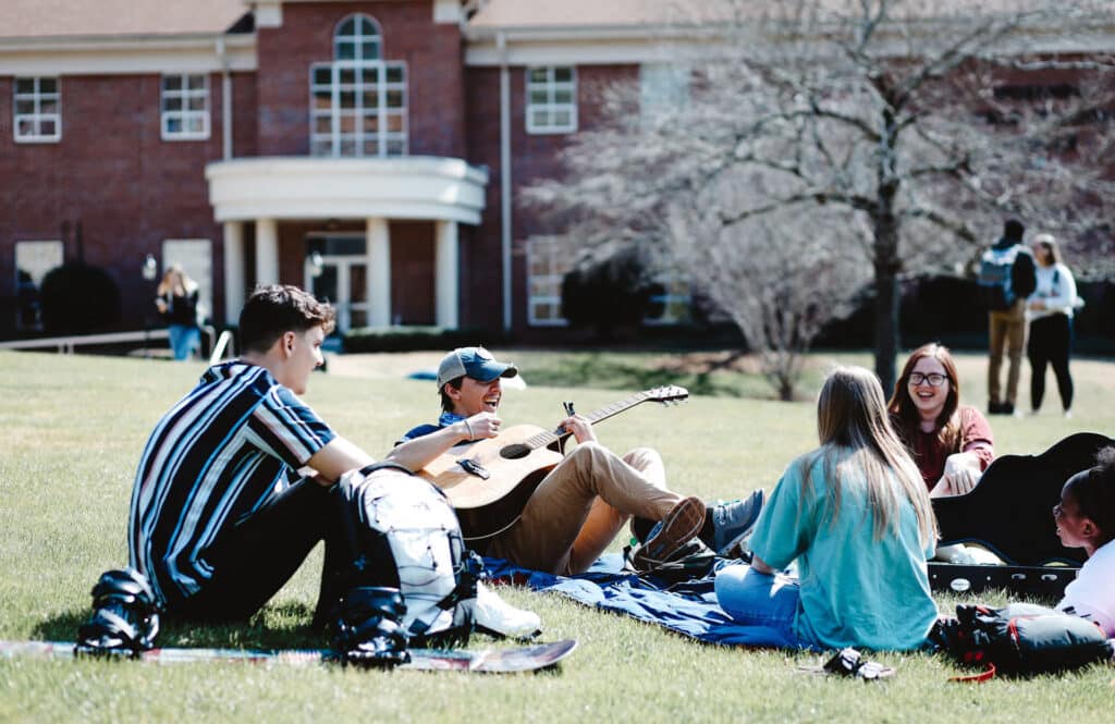 Young people sitting outside