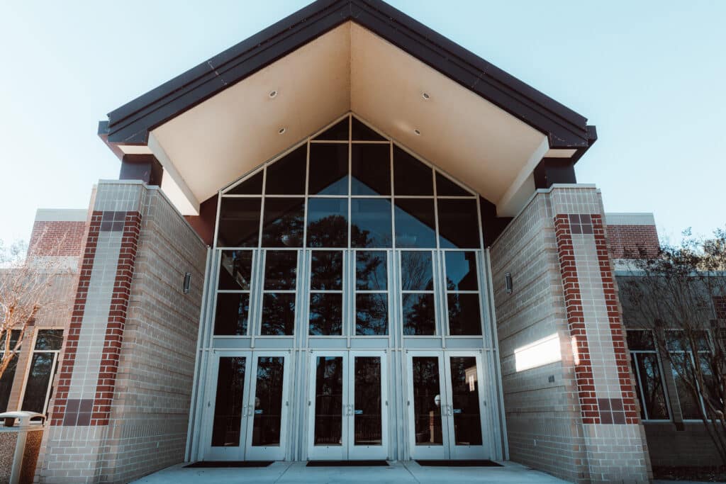 front of building entrance with glass and brick