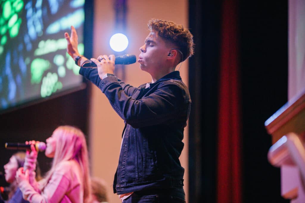 Student leading worship.