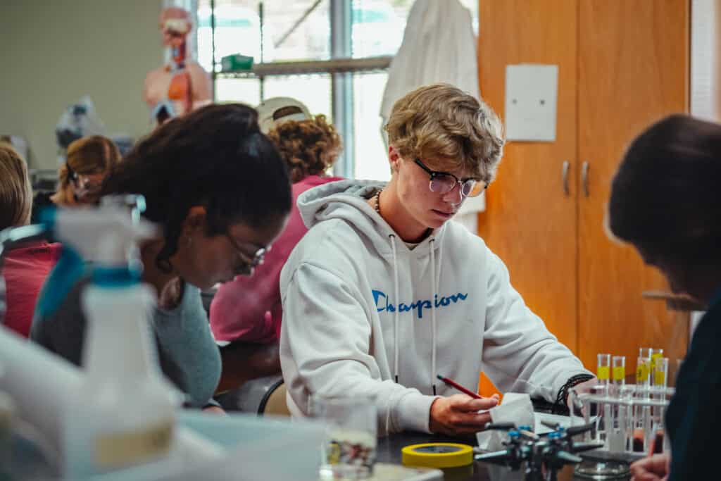 Toccoa Falls College students in a bio lab