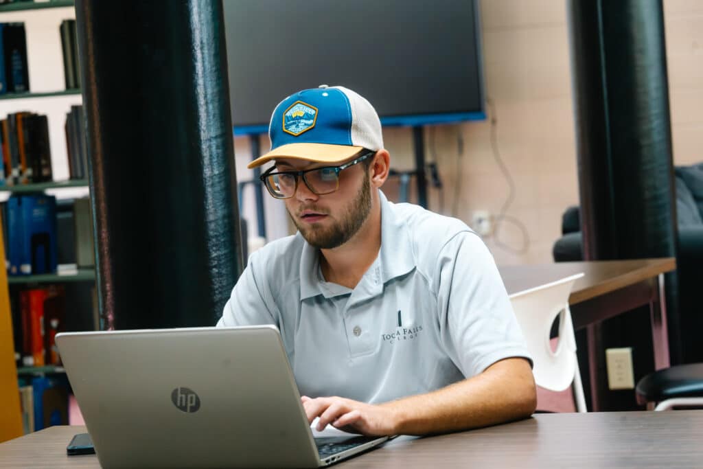 a student working on his computer.