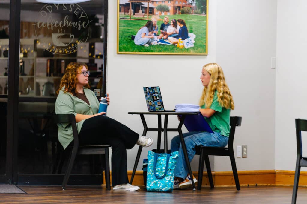 Two students talking and discussing in the Student Center.