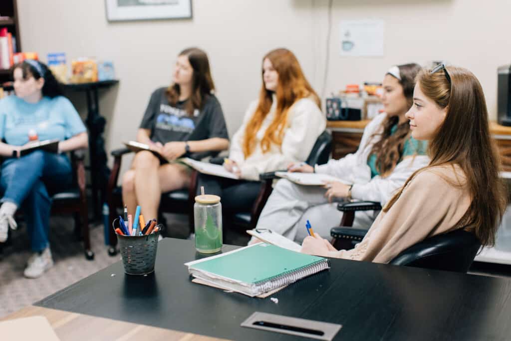 students having a discussion in class.