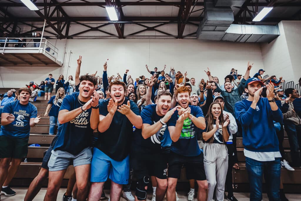 Toccoa Falls College Students cheer in a gym