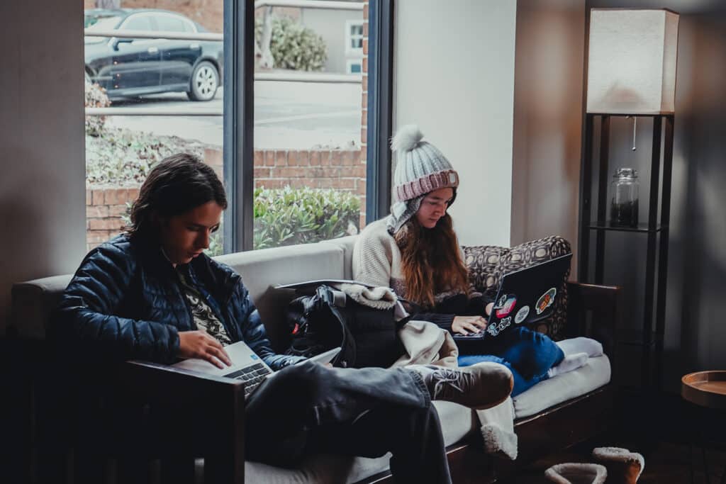Two Toccoa Falls College students work on their laptops