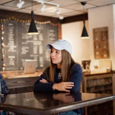Toccoa Falls College students talk in a cafe