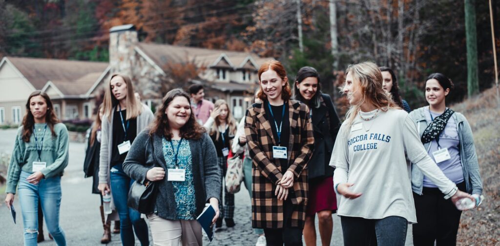 A Toccoa Falls College student walks and leads an outdoor tour