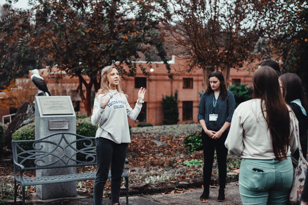A Toccoa Falls student leads a tour outside