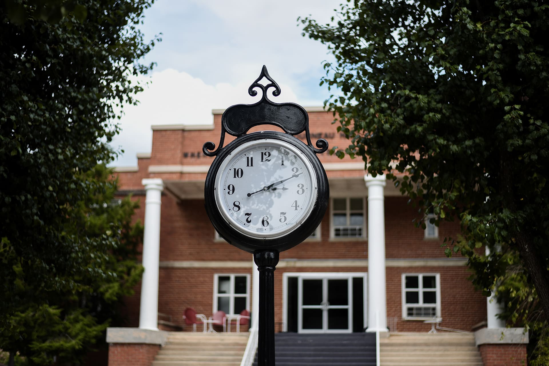 A large, analog clock on Toccoa Falls campus