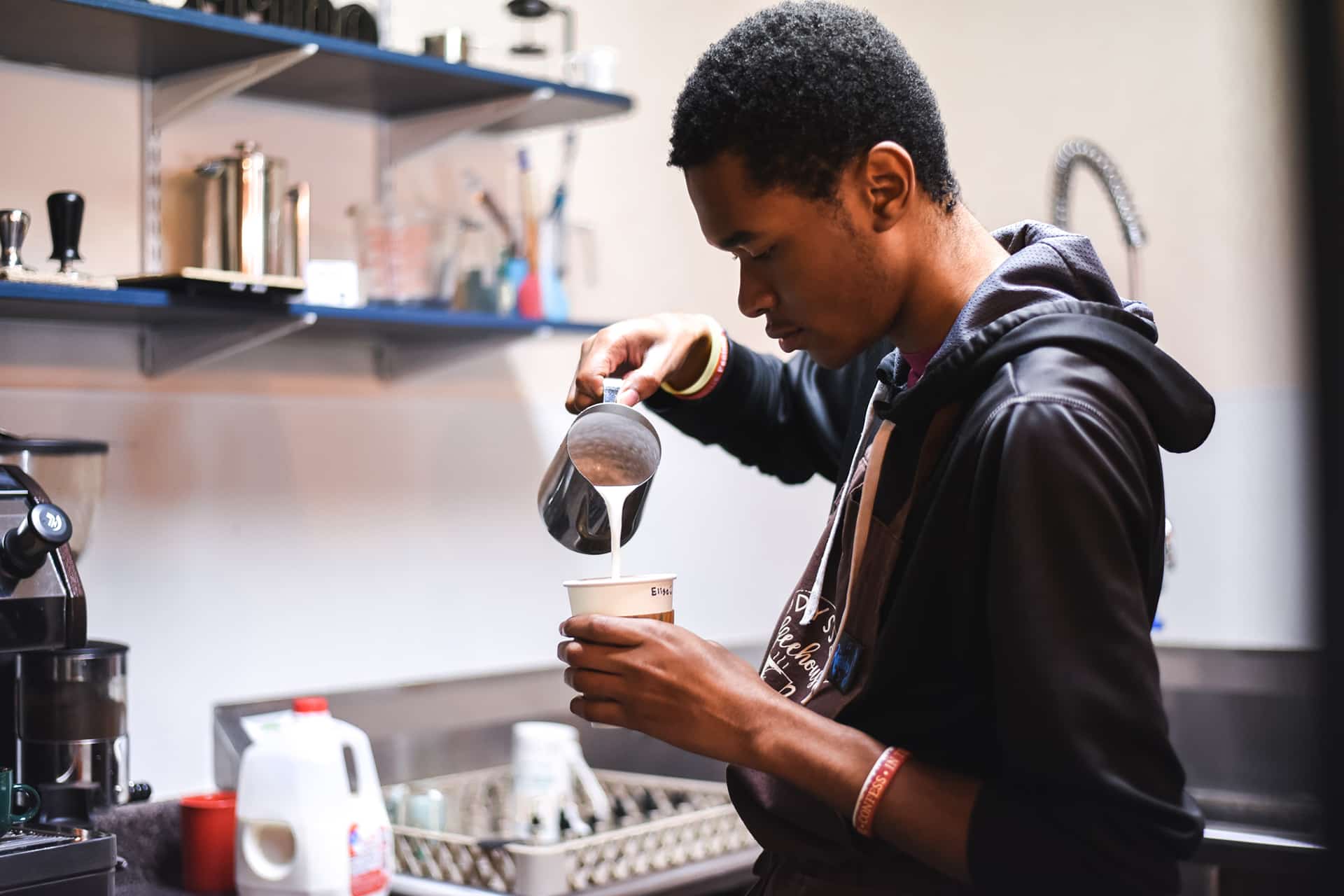 A Toccoa Falls College student makes a latte in a cafe