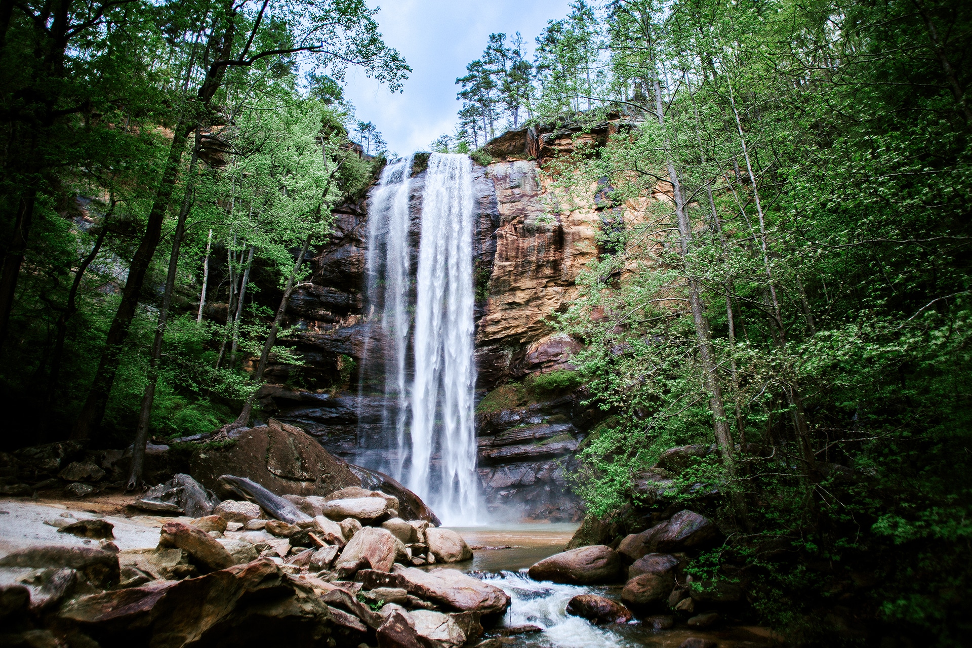 Toccoa Falls in summer, lush with foliage