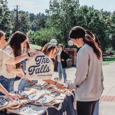 Toccoa Falls College distribute tote bags on the campus to newly arrived students