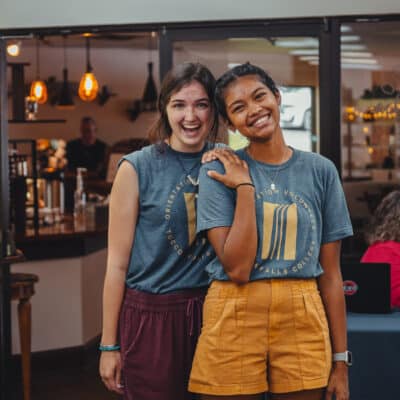 students with matching tfc shirts in a dining area