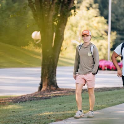 Students walking and smiling outside