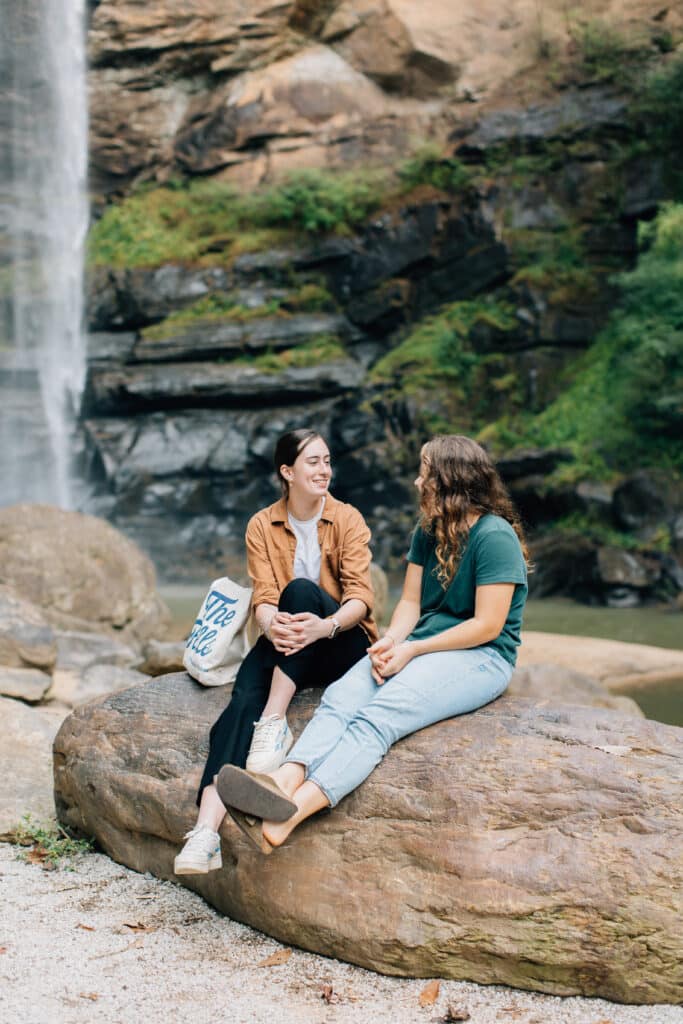 Students talking at waterfall