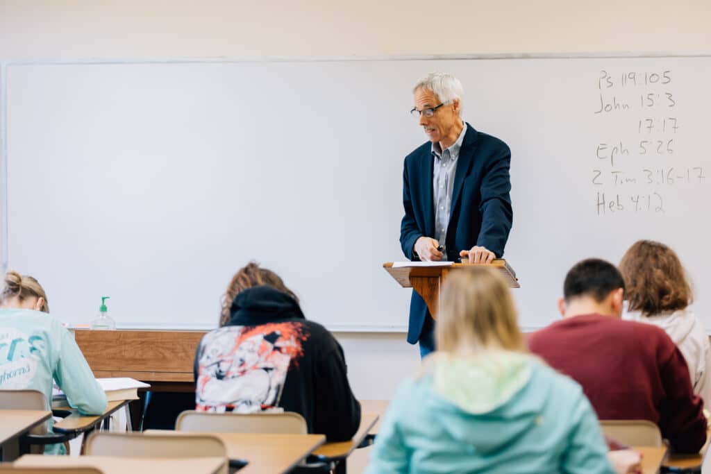 Dr. Junker teaching in class.
