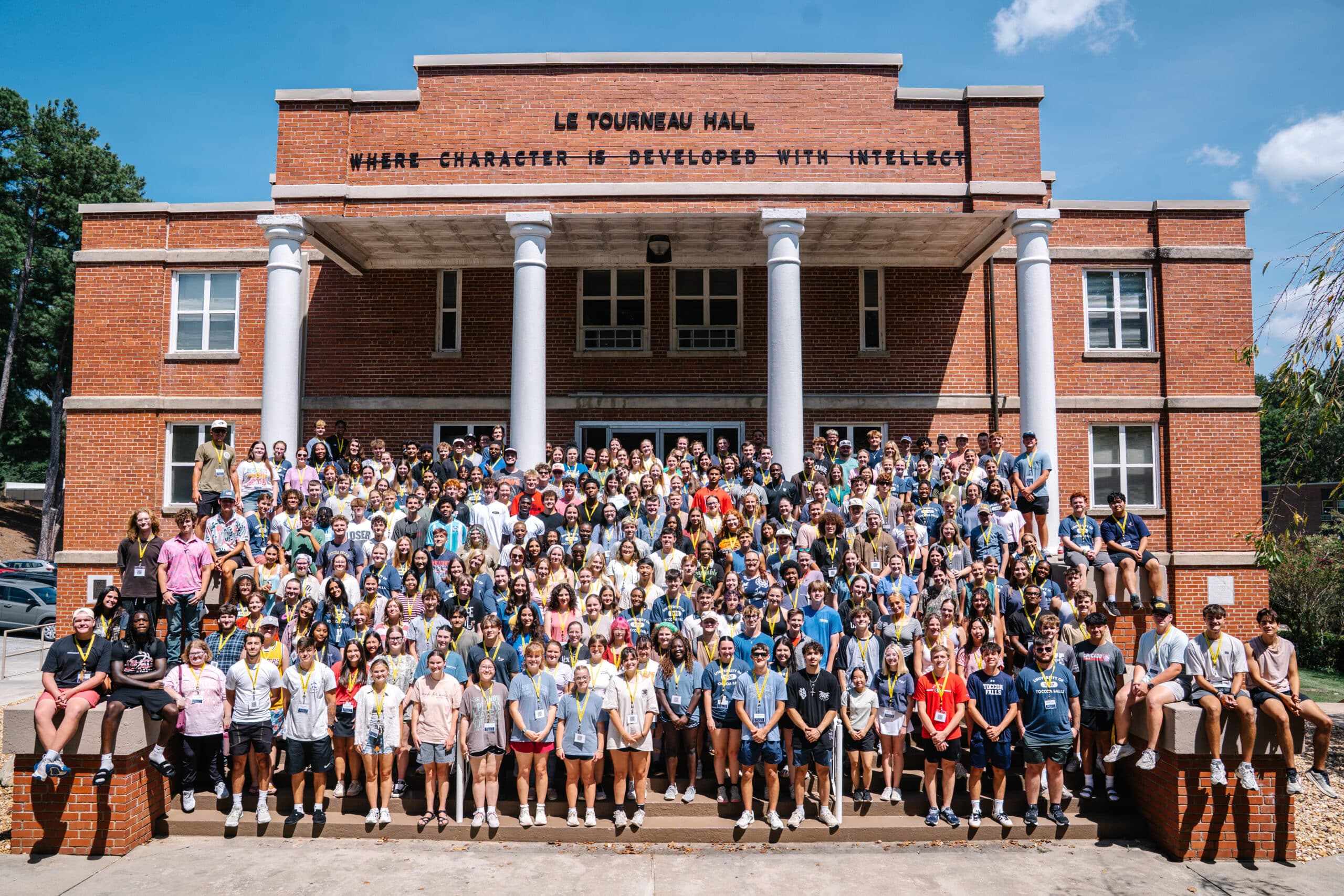 Large group of students on steps of building